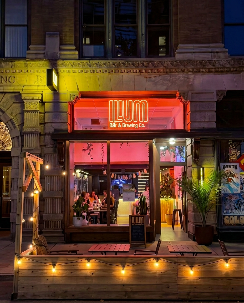 Ilium Bar interior with exposed brick and brass fixtures