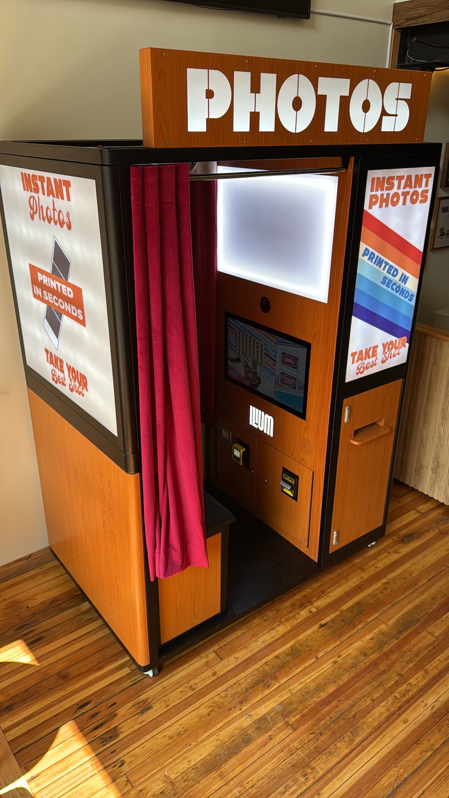 Vintage Ilium photo booth with retro signage