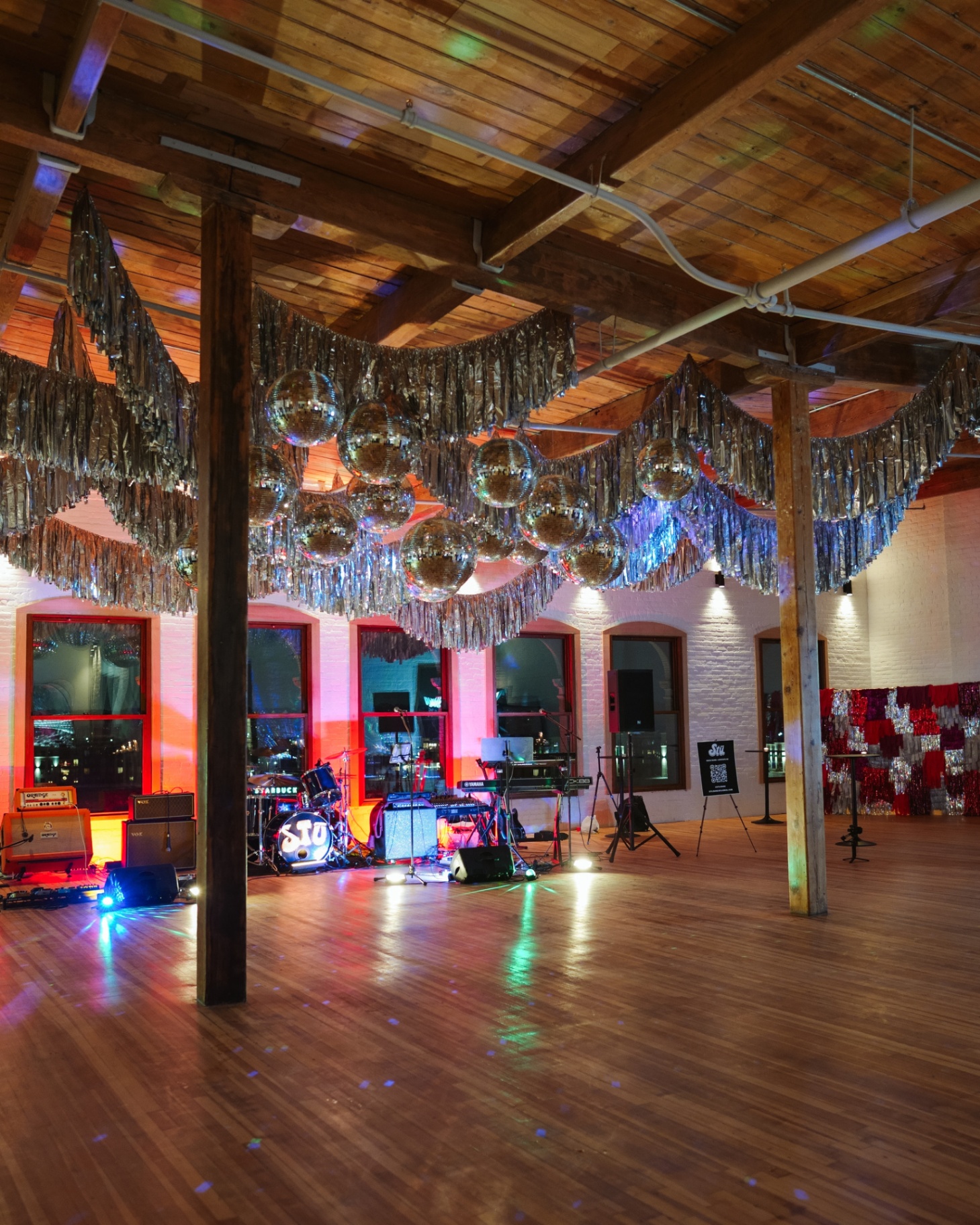 Evermore Hall dance floor with disco balls and band setup