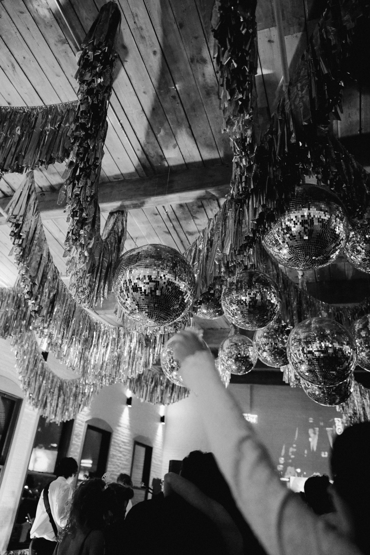 Disco balls and tinsel decorations at Evermore Hall