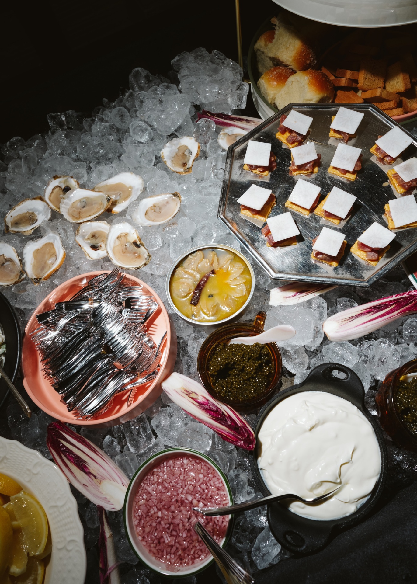 Oysters, caviar, and hors d'oeuvres spread on ice