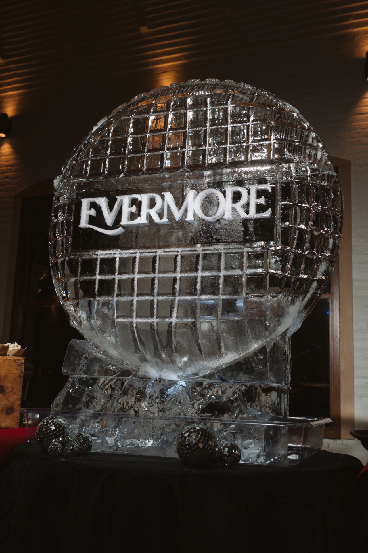Evermore ice sculpture with disco ball accents